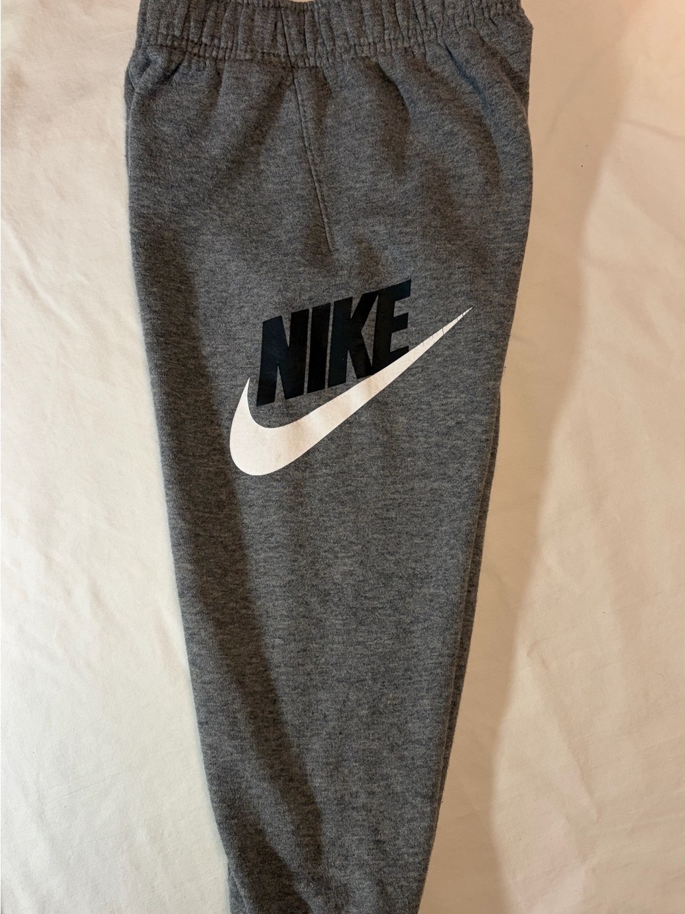 Nike Gray Joggers with White Swoosh and Black Logo